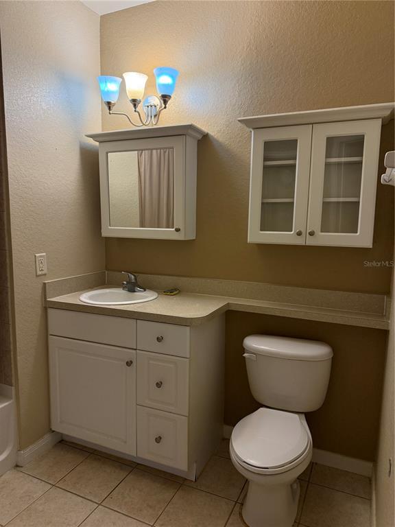 260 Old Village Center Circle, Unit 8205 St. Augustine, FL 32084 - Photo 7 of 13 a bathroom with a toilet sink and mirror