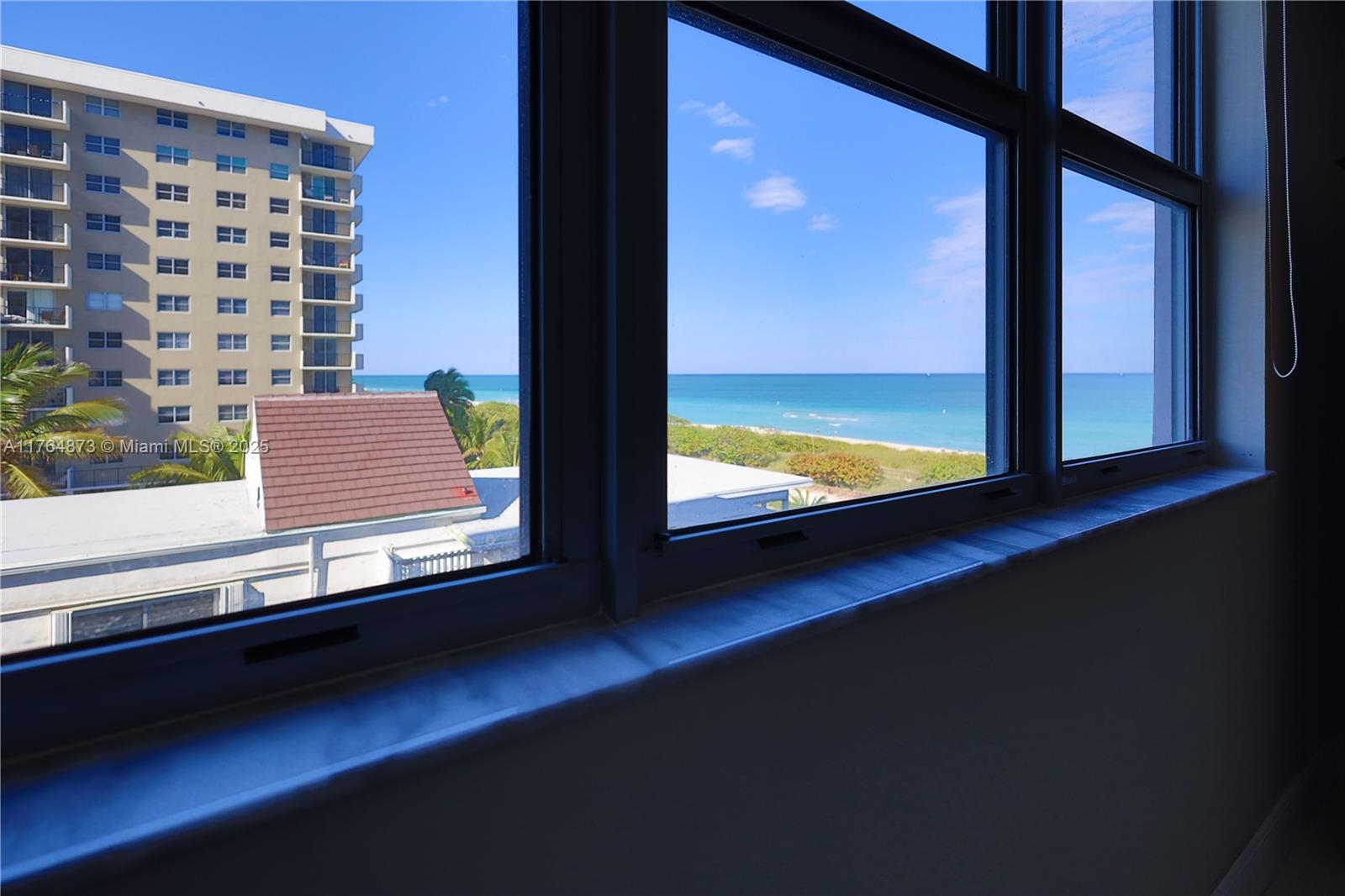 9225 Collins Avenue, Unit 503 Surfside, FL 33154 - Photo 2 of 37 a view of a large window with an outdoor space