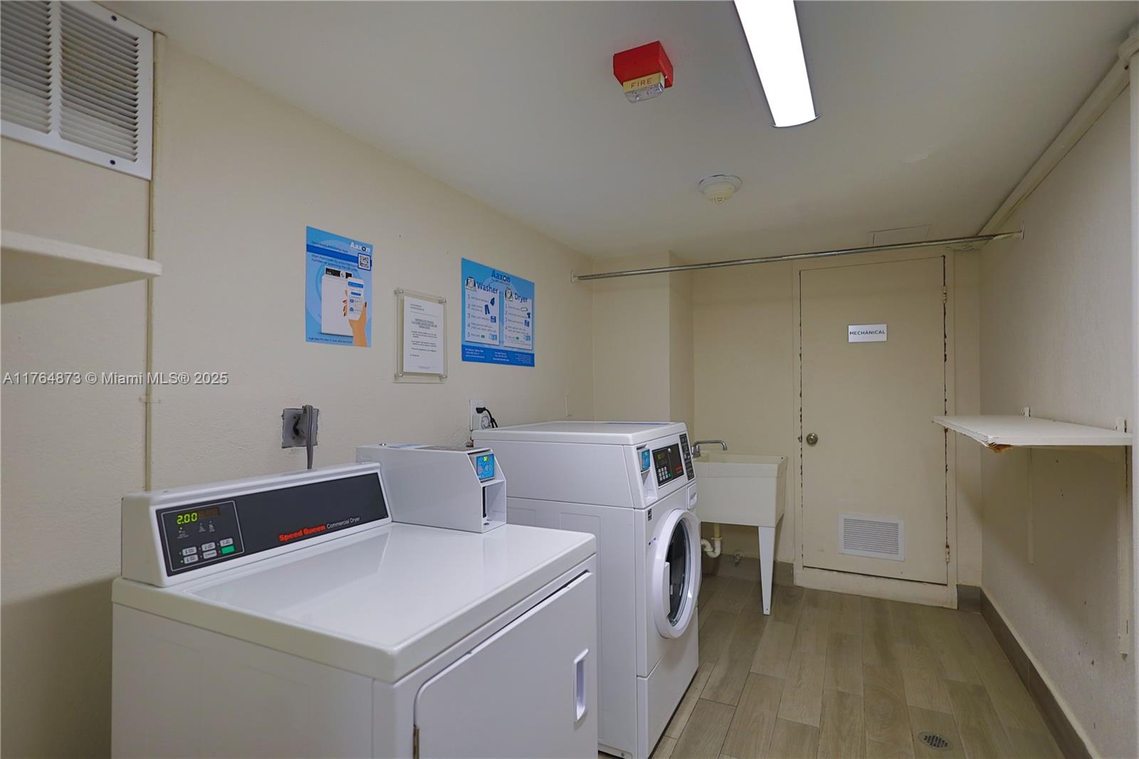 9225 Collins Avenue, Unit 503 Surfside, FL 33154 - Photo 29 of 37 a utility room with dryer and washer