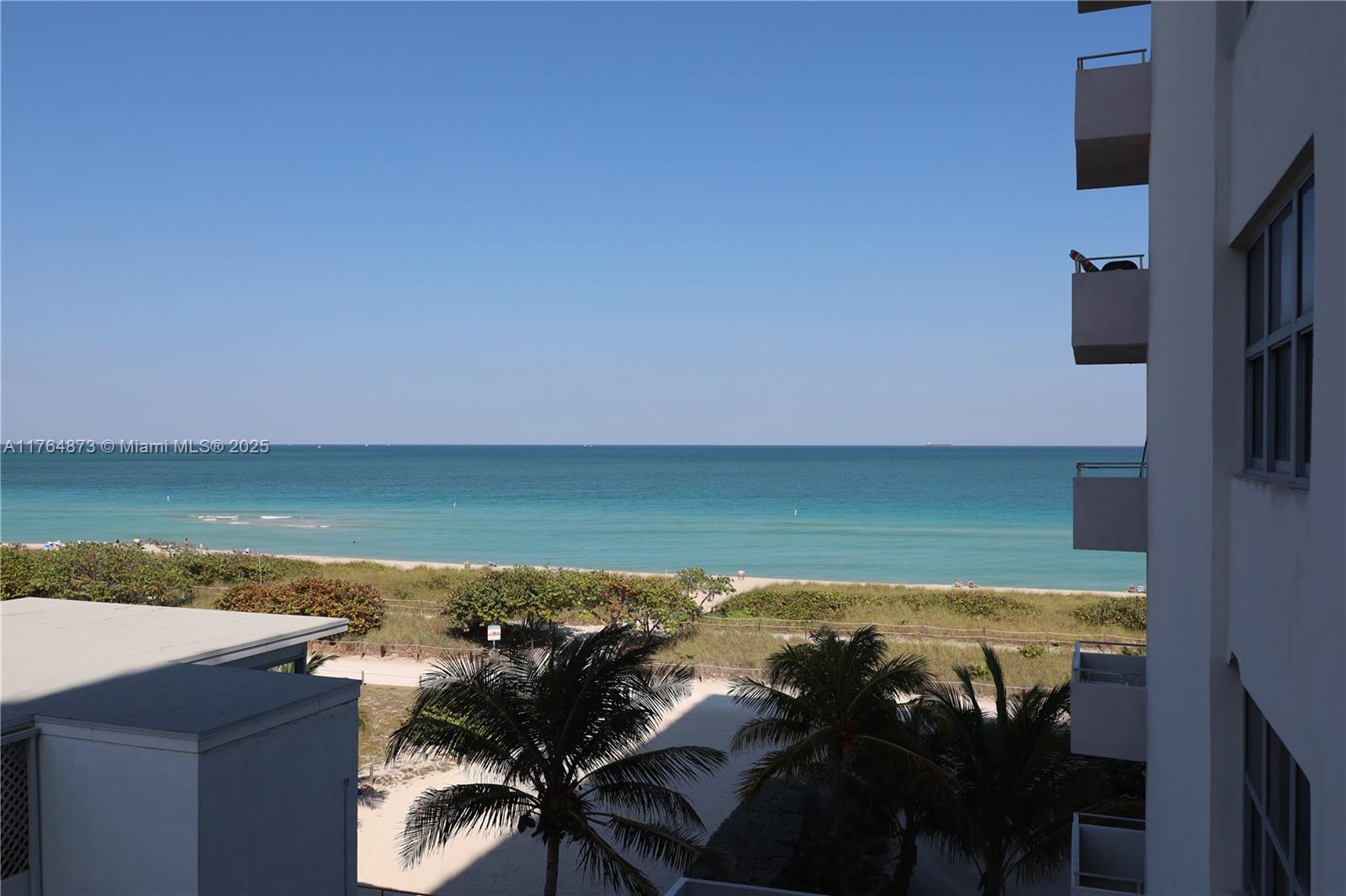 9225 Collins Avenue, Unit 503 Surfside, FL 33154 - Photo 3 of 37 a view of a lake from a yard