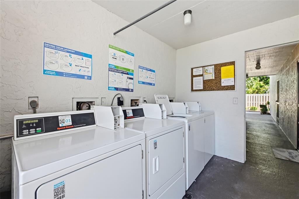 5683 Midnight Pass Road, Unit 110 Sarasota, FL 34242 - Photo 16 of 19 a view of living room with washer and dryer