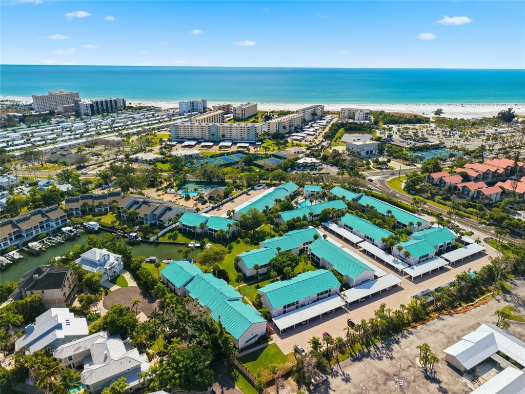 5683 Midnight Pass Road, Unit 110 Sarasota, FL 34242 - Photo 5 of 19 an aerial view of residential houses with outdoor space and swimming pool