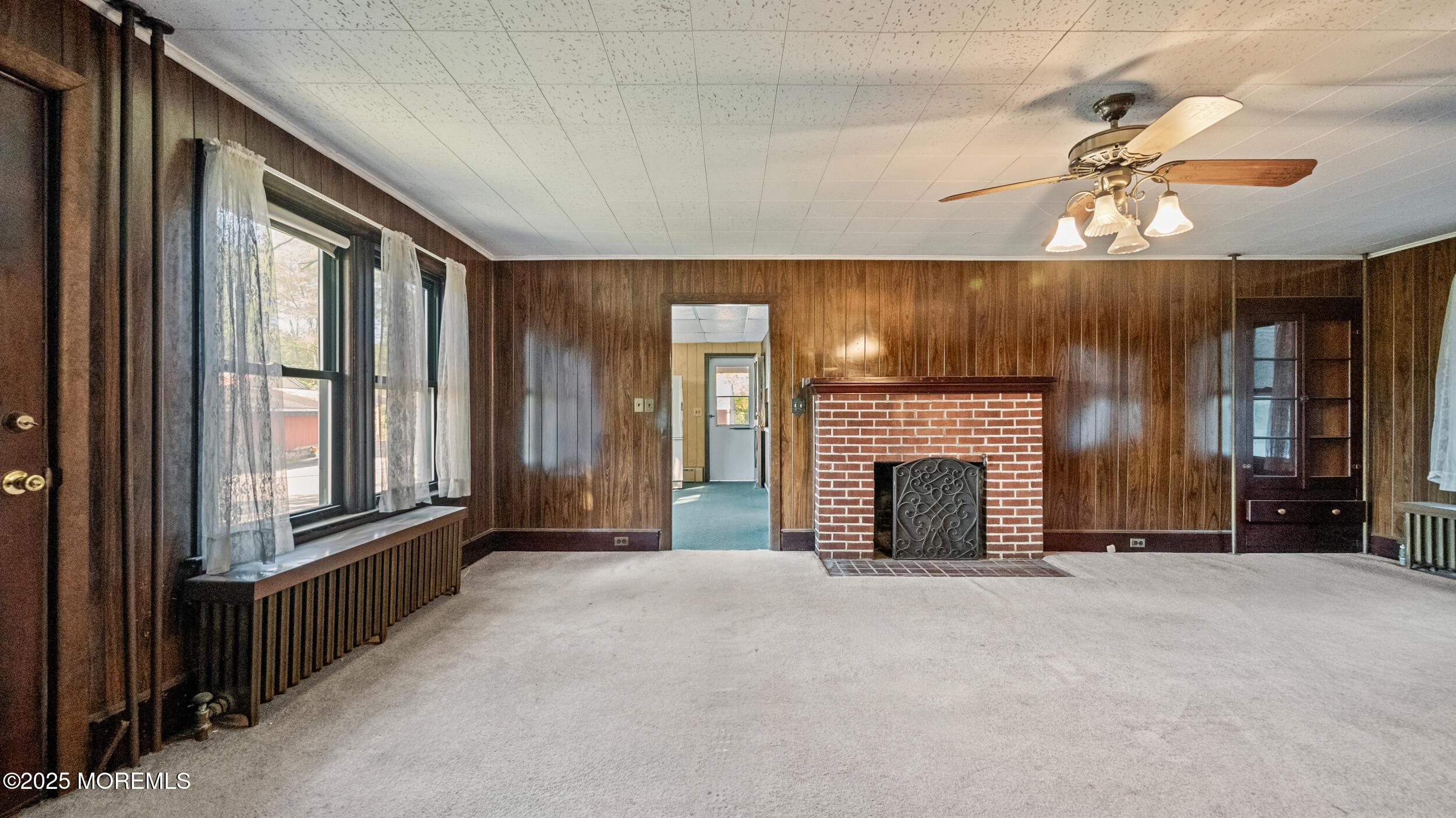 4641 Crosswicks Hamilton Square Road Robbinsville, NJ 08691 - Photo 18 of 58 a view of an empty room with a fireplace and a window