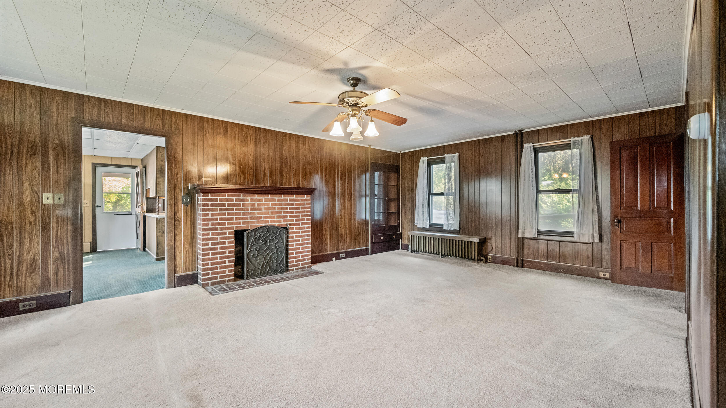 4641 Crosswicks Hamilton Square Road Robbinsville, NJ 08691 - Photo 19 of 58 a view of an empty room with a fireplace and a window