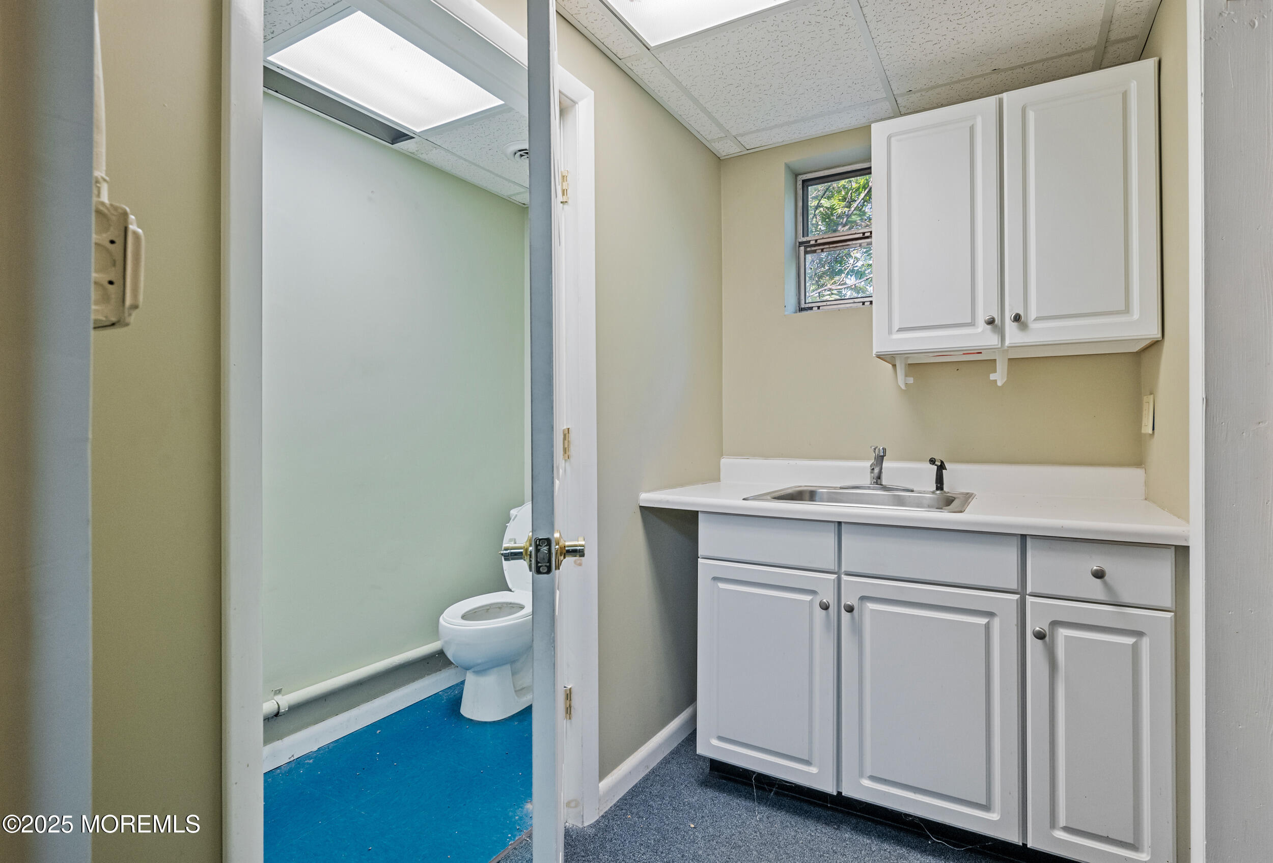 4641 Crosswicks Hamilton Square Road Robbinsville, NJ 08691 - Photo 50 of 58 a bathroom with a sink a toilet and a mirror