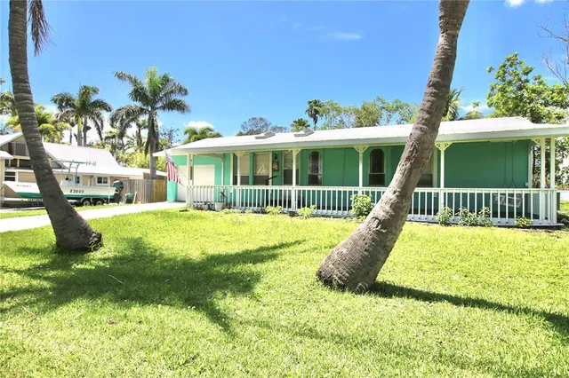 a view of house with a swimming pool