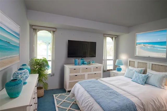 a bedroom with a bed and a flat screen television