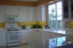 4644 Sweetgale Drive San Ramon, CA 94582 - Photo 6 of 7 a kitchen with granite countertop white cabinets and window