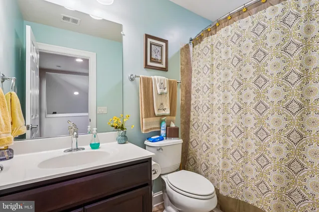 a front view of a house with a yard table and chairs