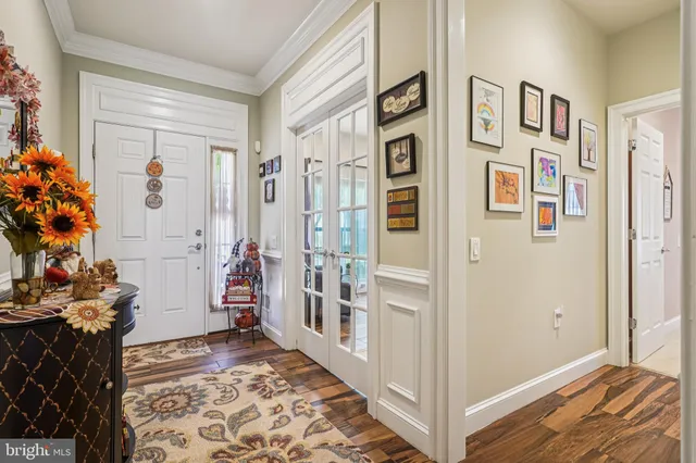 a view of an entryway with wooden floor