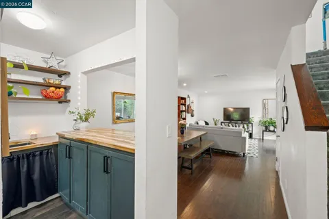 a kitchen with a sink and a stove top oven
