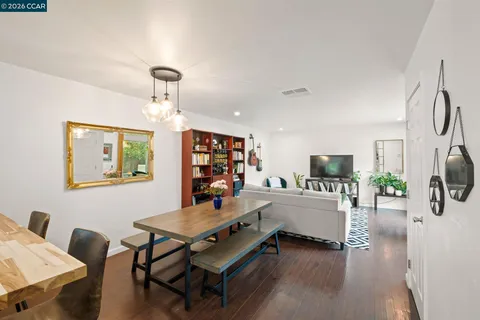 a view of a livingroom with furniture and a flat screen tv