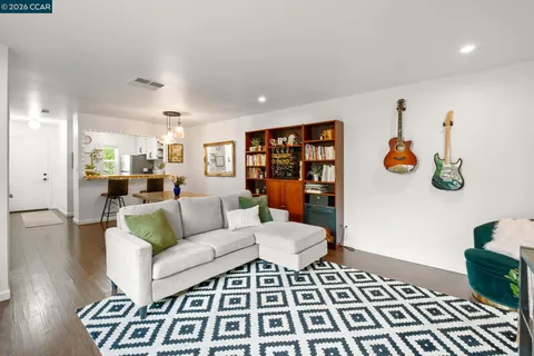 a living room with furniture and a table