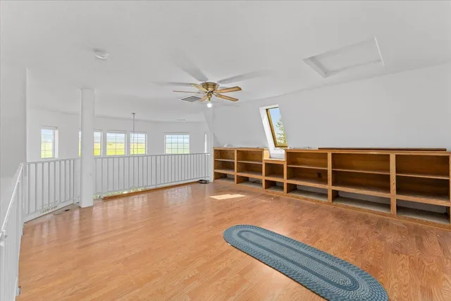 a bedroom with bed and a window