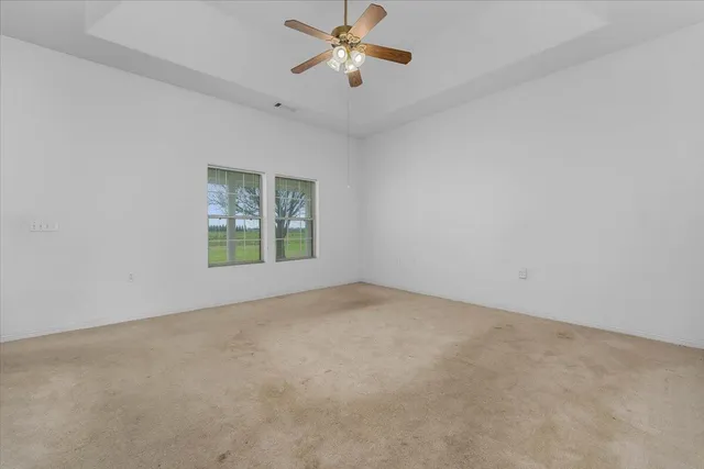 a front view of a house with a yard and an outdoor seating
