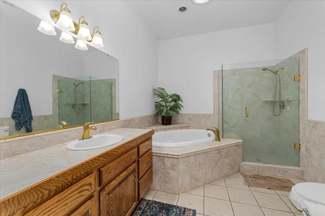 a view of a livingroom with a fireplace and window