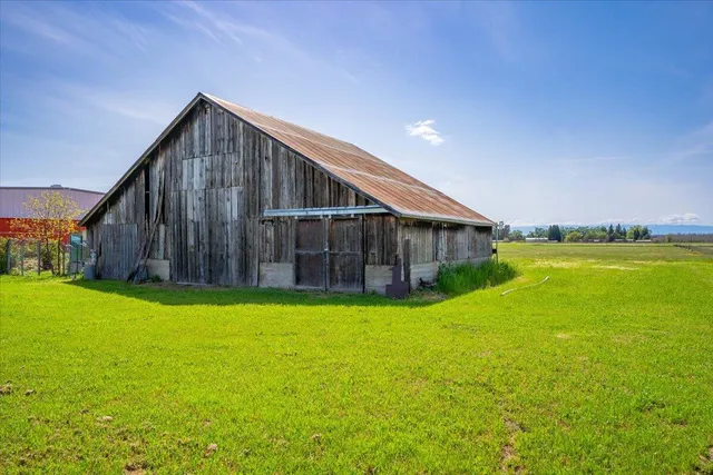 a view of a big yard with a house