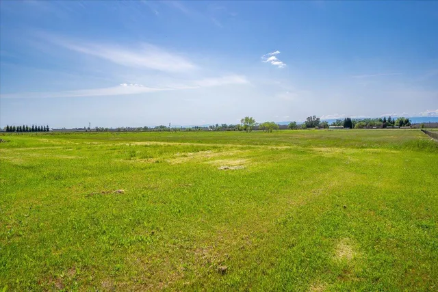 a view of a swimming pool with an outdoor seating and house