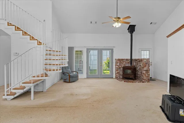 a kitchen with stainless steel appliances granite countertop a refrigerator and a stove