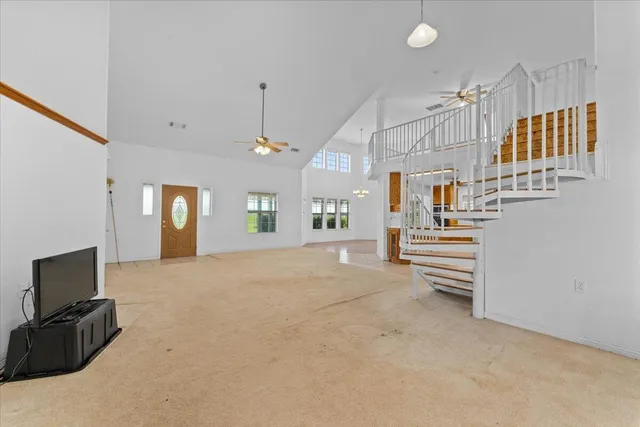 a kitchen with granite countertop a stove top oven microwave and cabinets