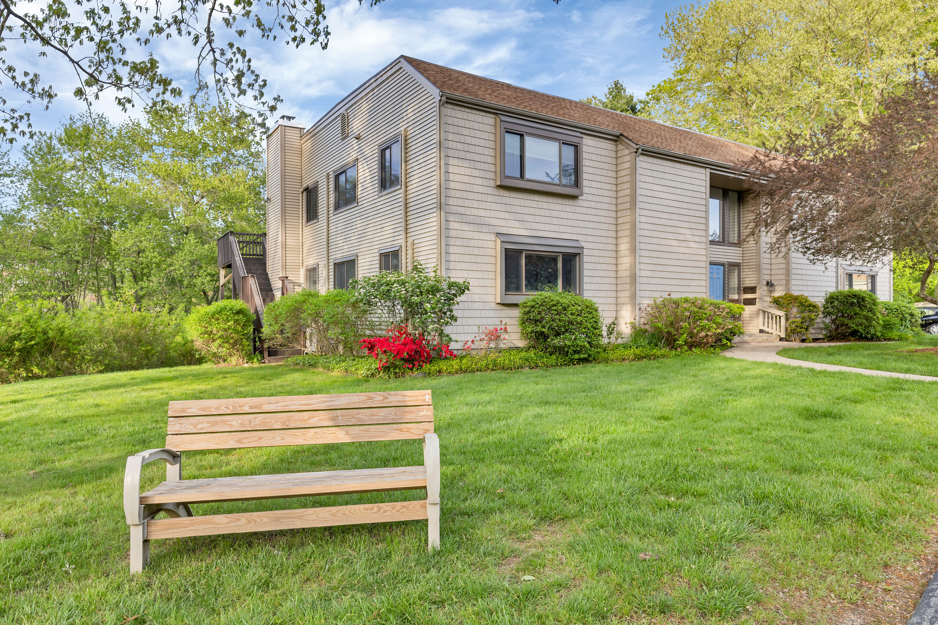 a front view of a house with garden
