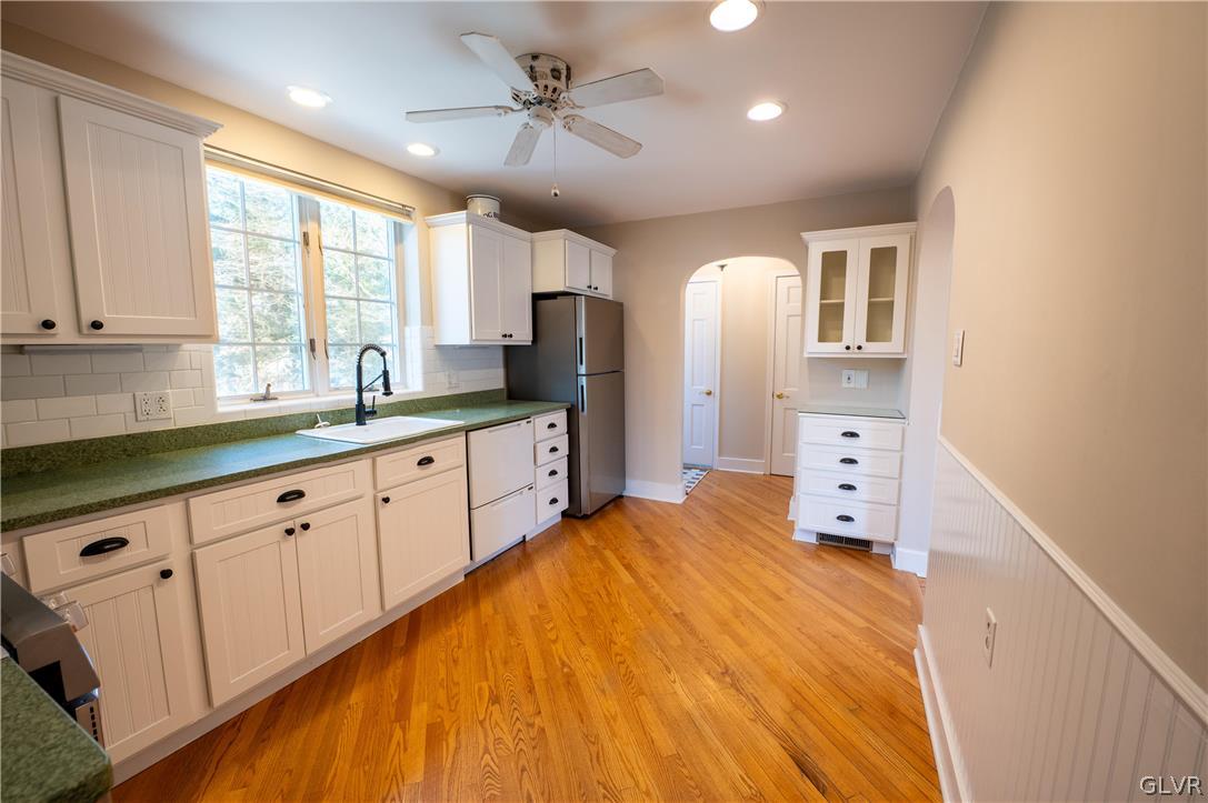 719 14th Avenue Bethlehem, PA 18018 - Photo 12 of 33 a large white kitchen with a large window