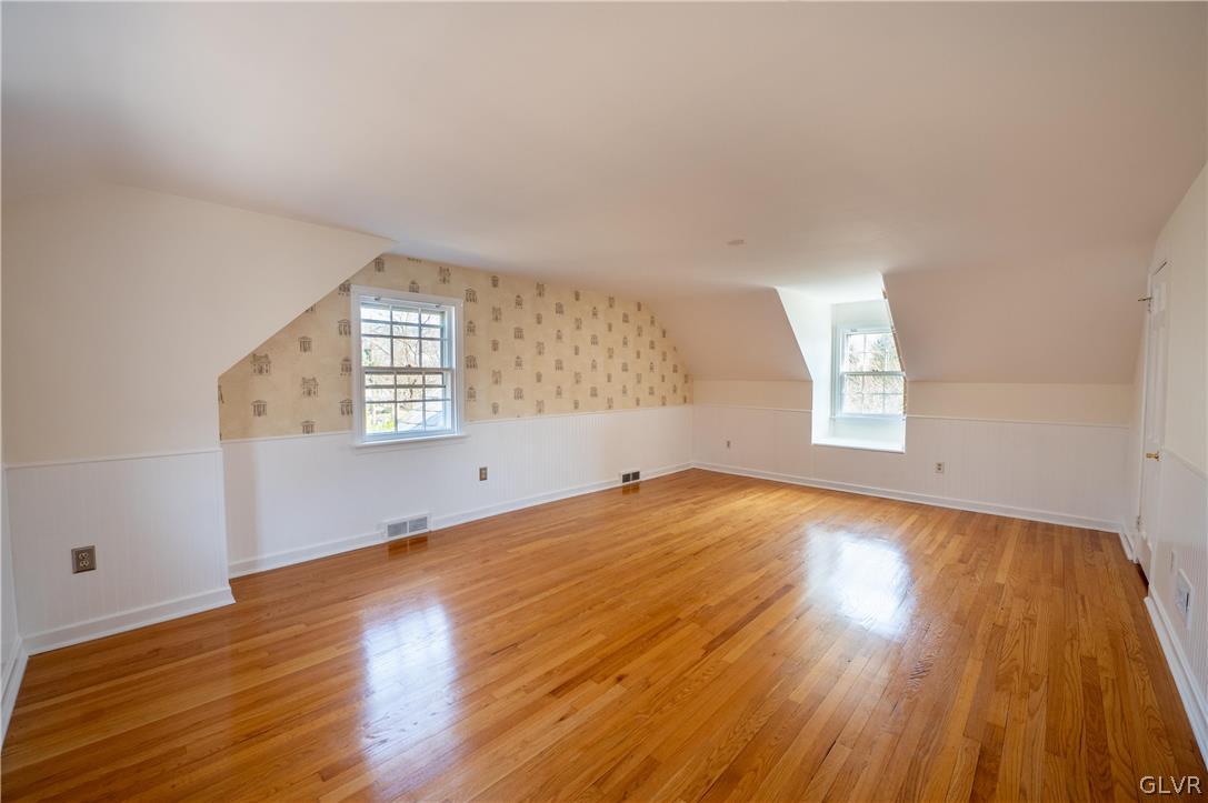 719 14th Avenue Bethlehem, PA 18018 - Photo 13 of 33 an empty room with wooden floor and windows