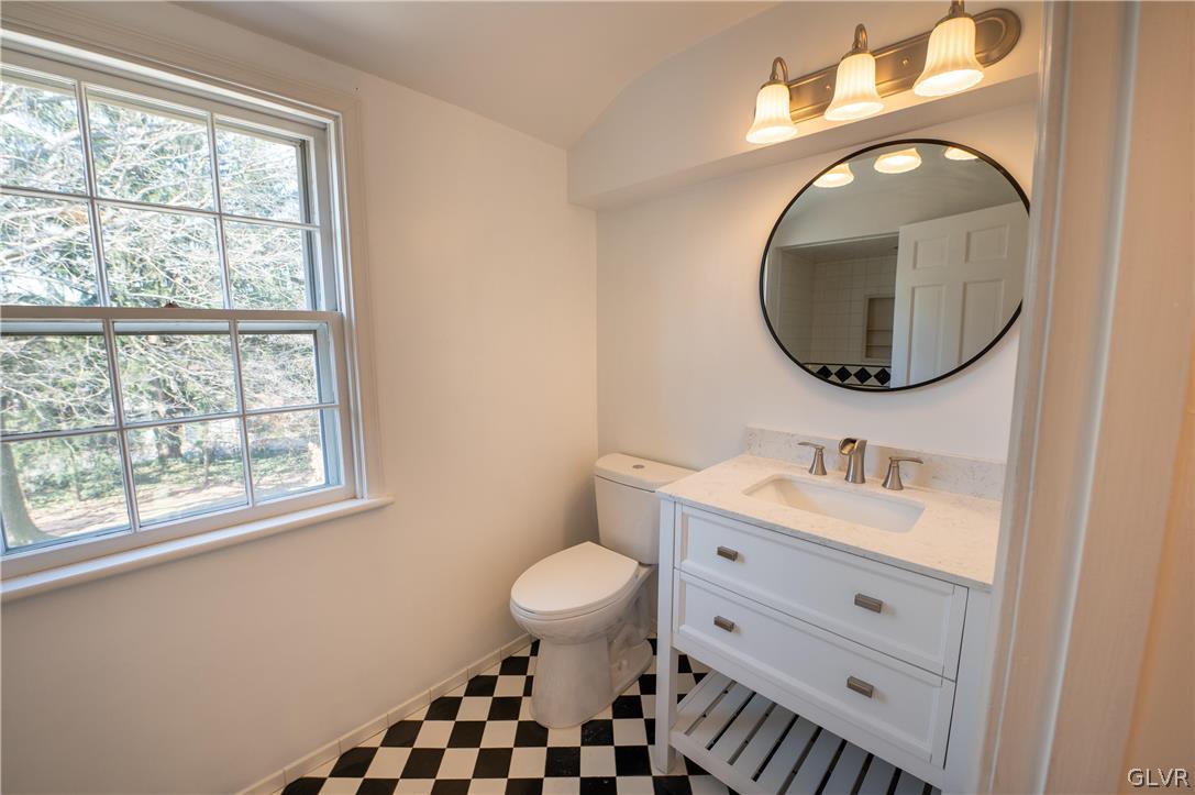 719 14th Avenue Bethlehem, PA 18018 - Photo 16 of 33 a bathroom with a sink a toilet and a mirror