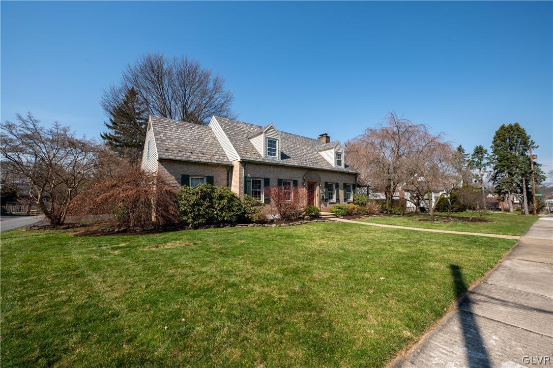 719 14th Avenue Bethlehem, PA 18018 - Photo 2 of 33 a front view of a house with a garden and trees