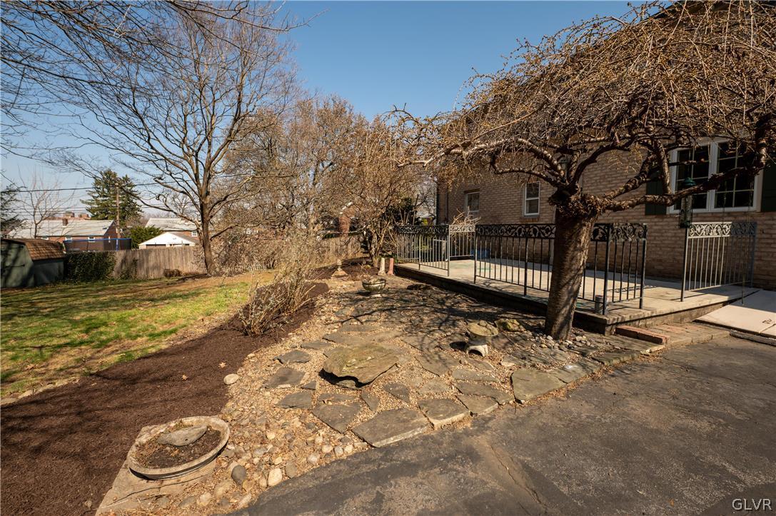 719 14th Avenue Bethlehem, PA 18018 - Photo 28 of 33 a backyard of a house with lots of trees