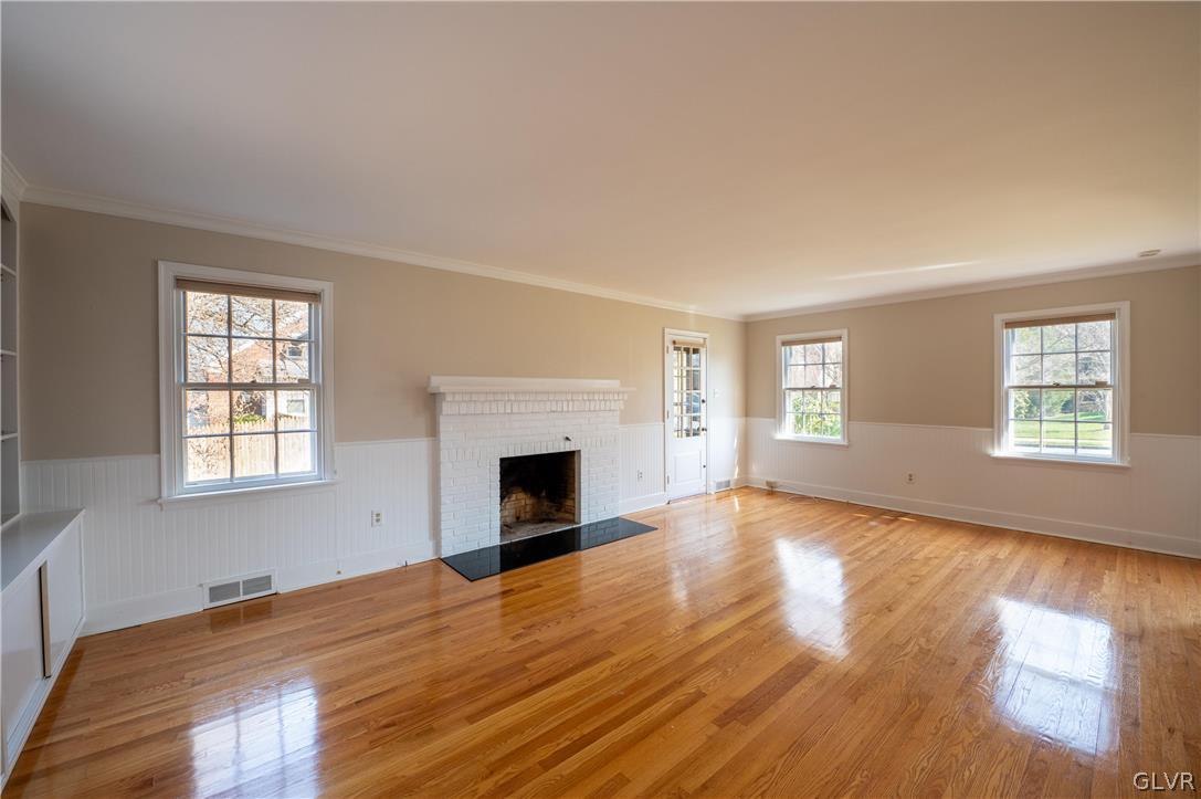 719 14th Avenue Bethlehem, PA 18018 - Photo 6 of 33 a view of empty room with wooden floor and fireplace