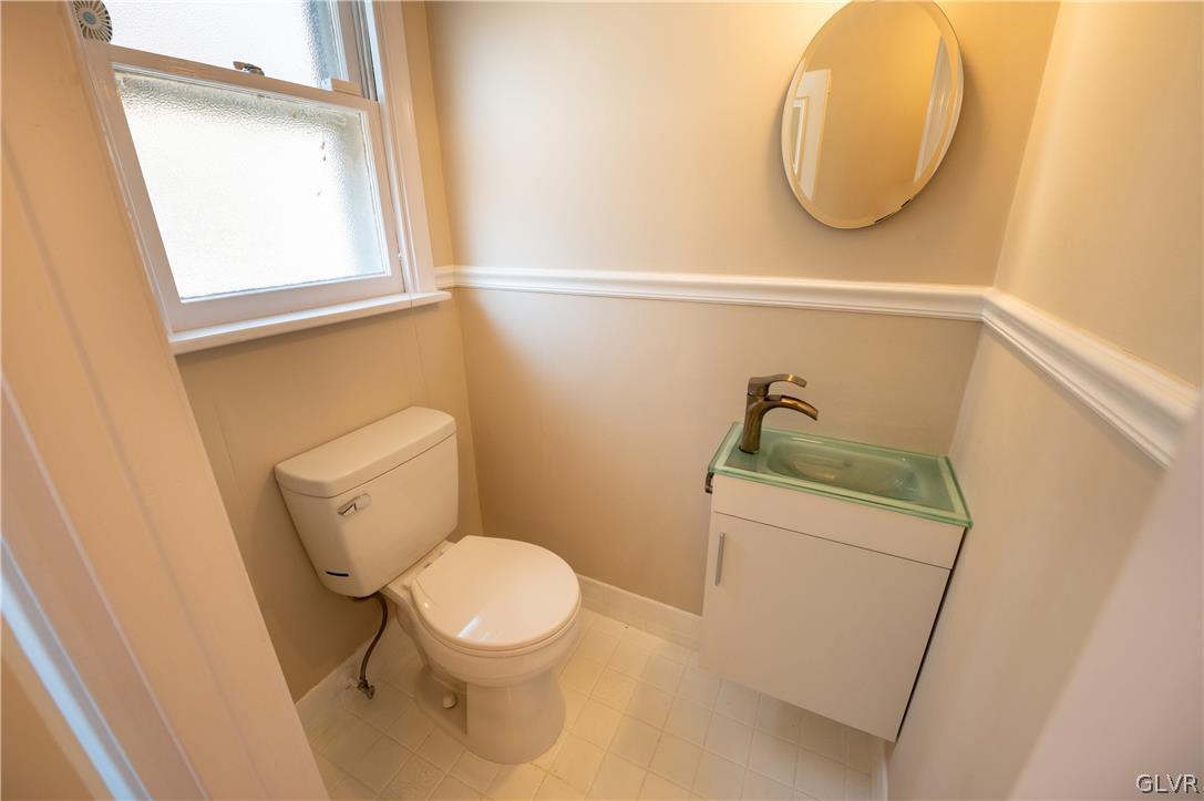 719 14th Avenue Bethlehem, PA 18018 - Photo 10 of 33 a bathroom with a toilet and a mirror