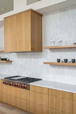 a dining room with furniture and a painting