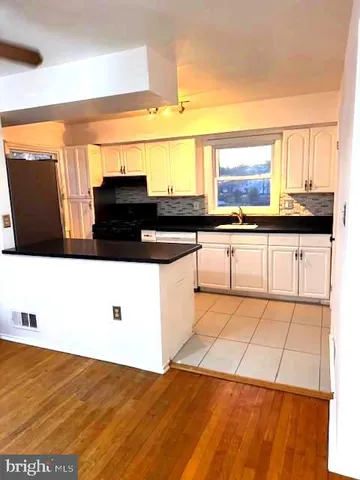a kitchen with stainless steel appliances a sink and a stove