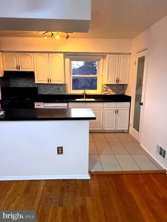 a kitchen with a sink and a stove