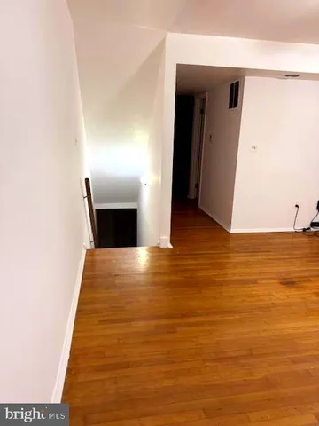 a bathroom with a sink vanity mirror and toilet