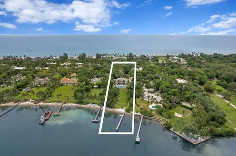 an aerial view of a golf course with parking space