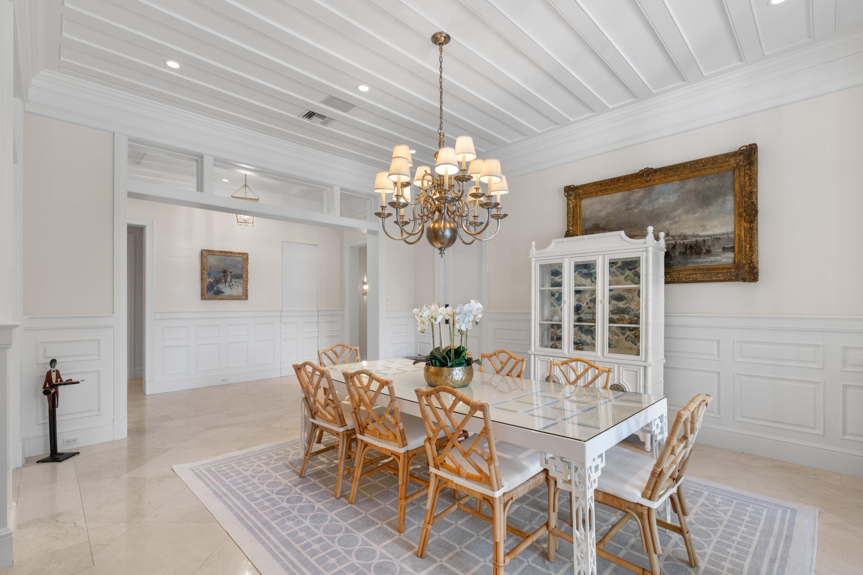 202 Gomez Road Hobe Sound, FL 33455 - Photo 12 of 33 a dining room with furniture and chandelier