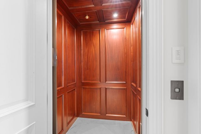 a view of front door with wooden floor