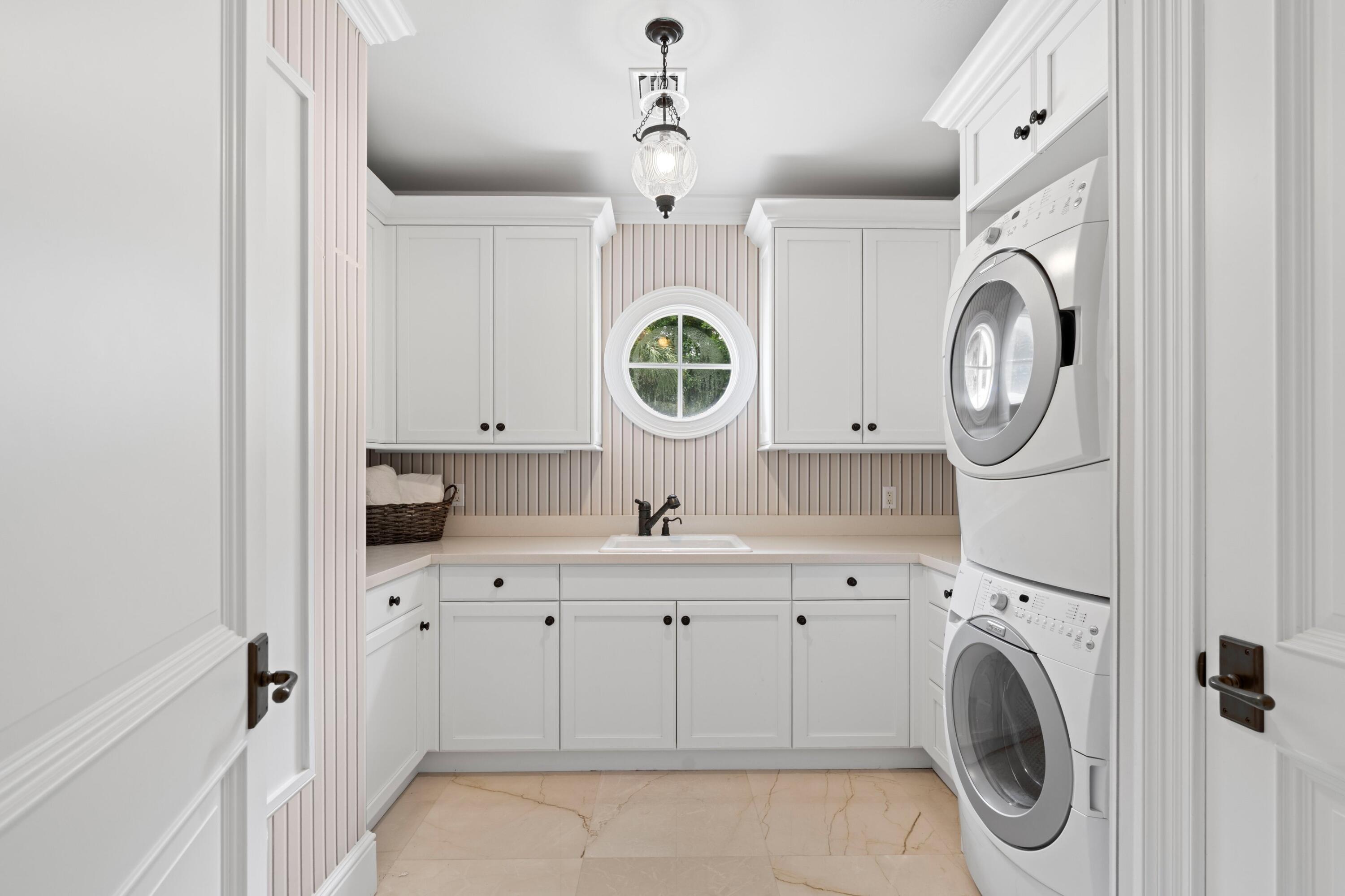 202 Gomez Road Hobe Sound, FL 33455 - Photo 22 of 33 a view of living room with washer and dryer