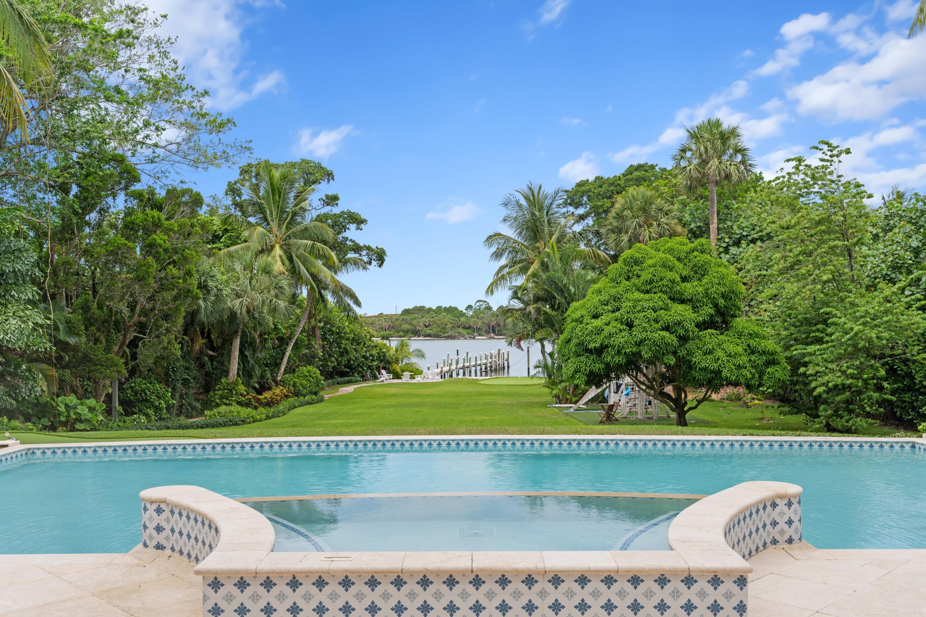 202 Gomez Road Hobe Sound, FL 33455 - Photo 25 of 33 a view of swimming pool with a garden