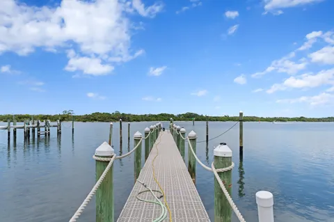 a view of a lake with a house in the background