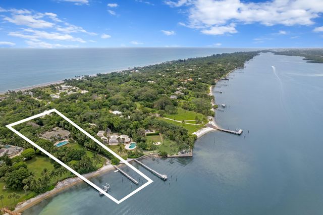 an aerial view of residential building with ocean view