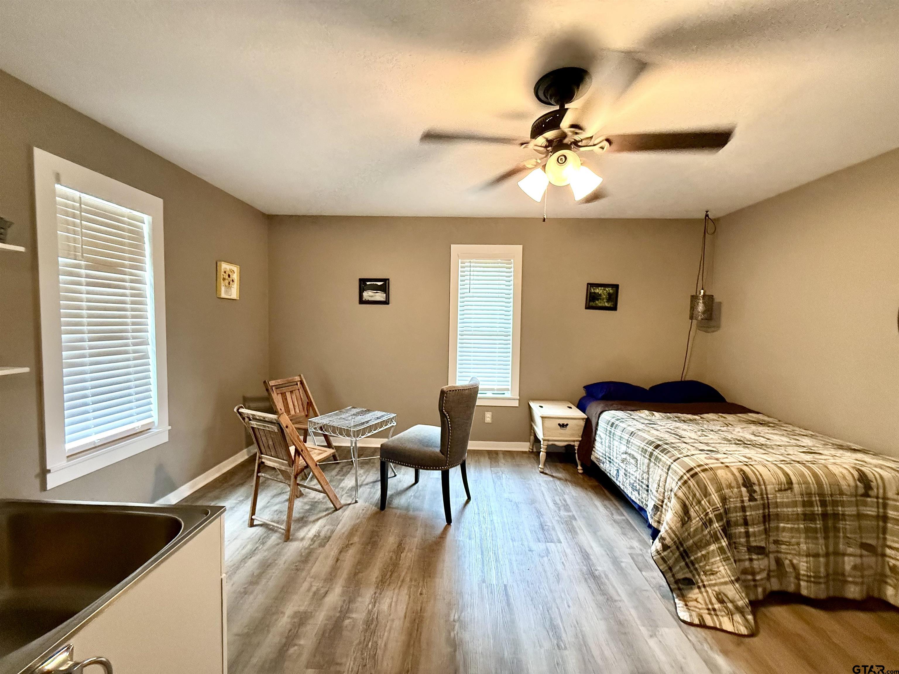 449 Rs Private Road Emory, TX 75440 - Photo 17 of 20 a bedroom with a bed and a chandelier