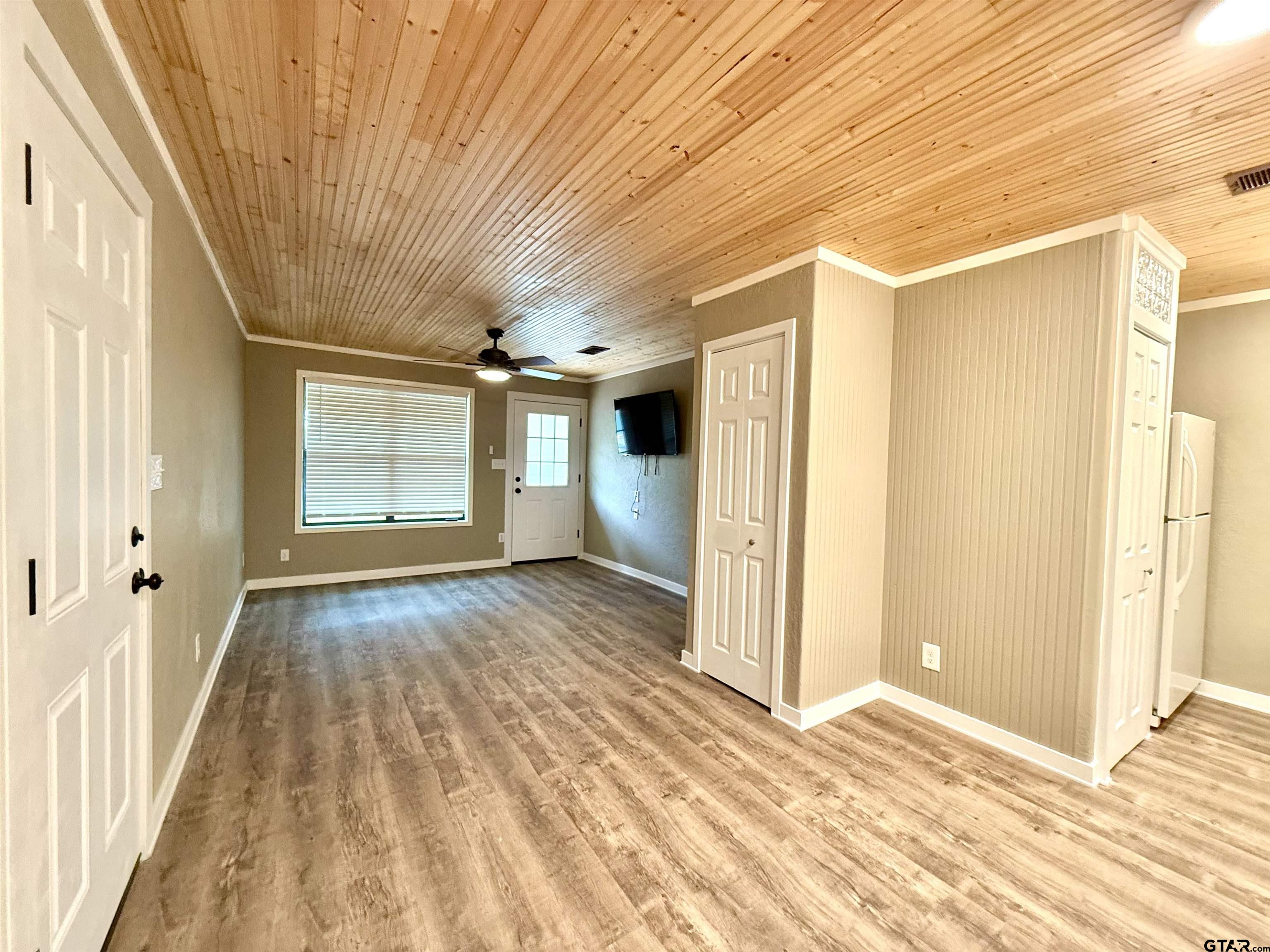 449 Rs Private Road Emory, TX 75440 - Photo 7 of 20 a view of a big room with wooden floor and windows