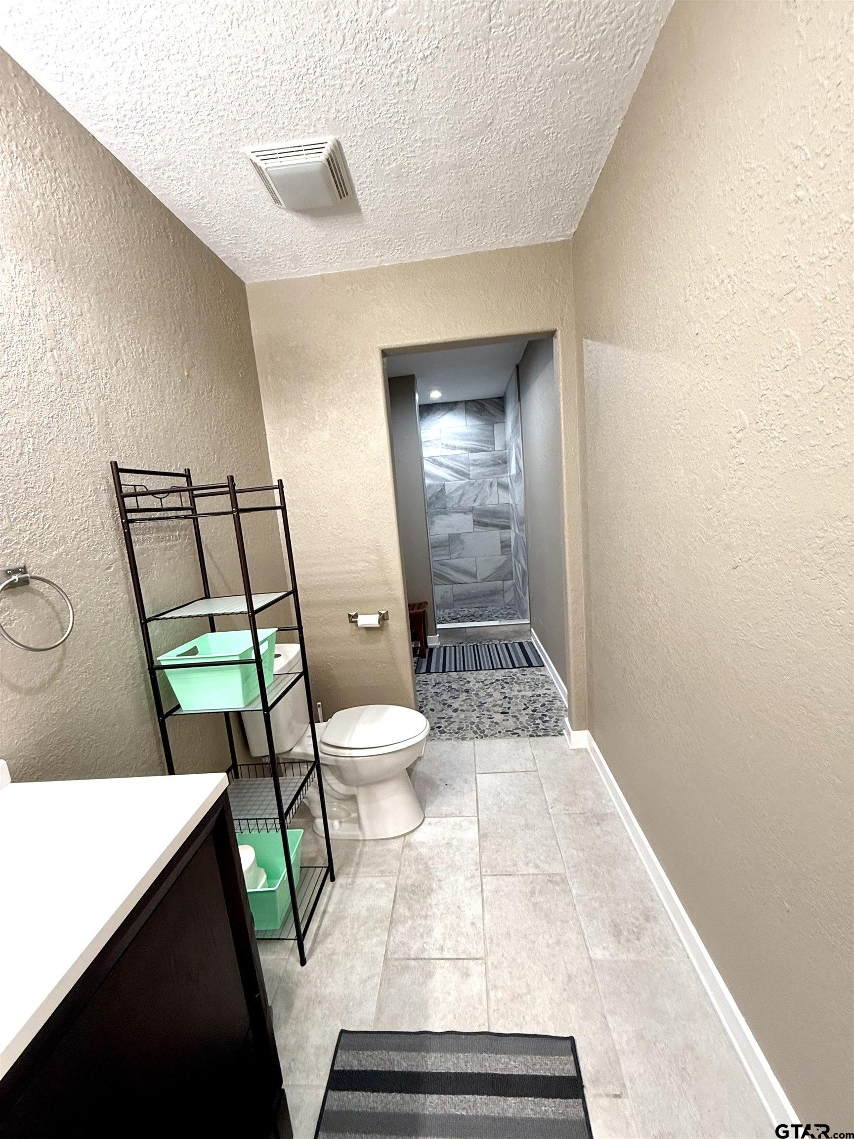 449 Rs Private Road Emory, TX 75440 - Photo 9 of 20 a bathroom with a toilet and a shower