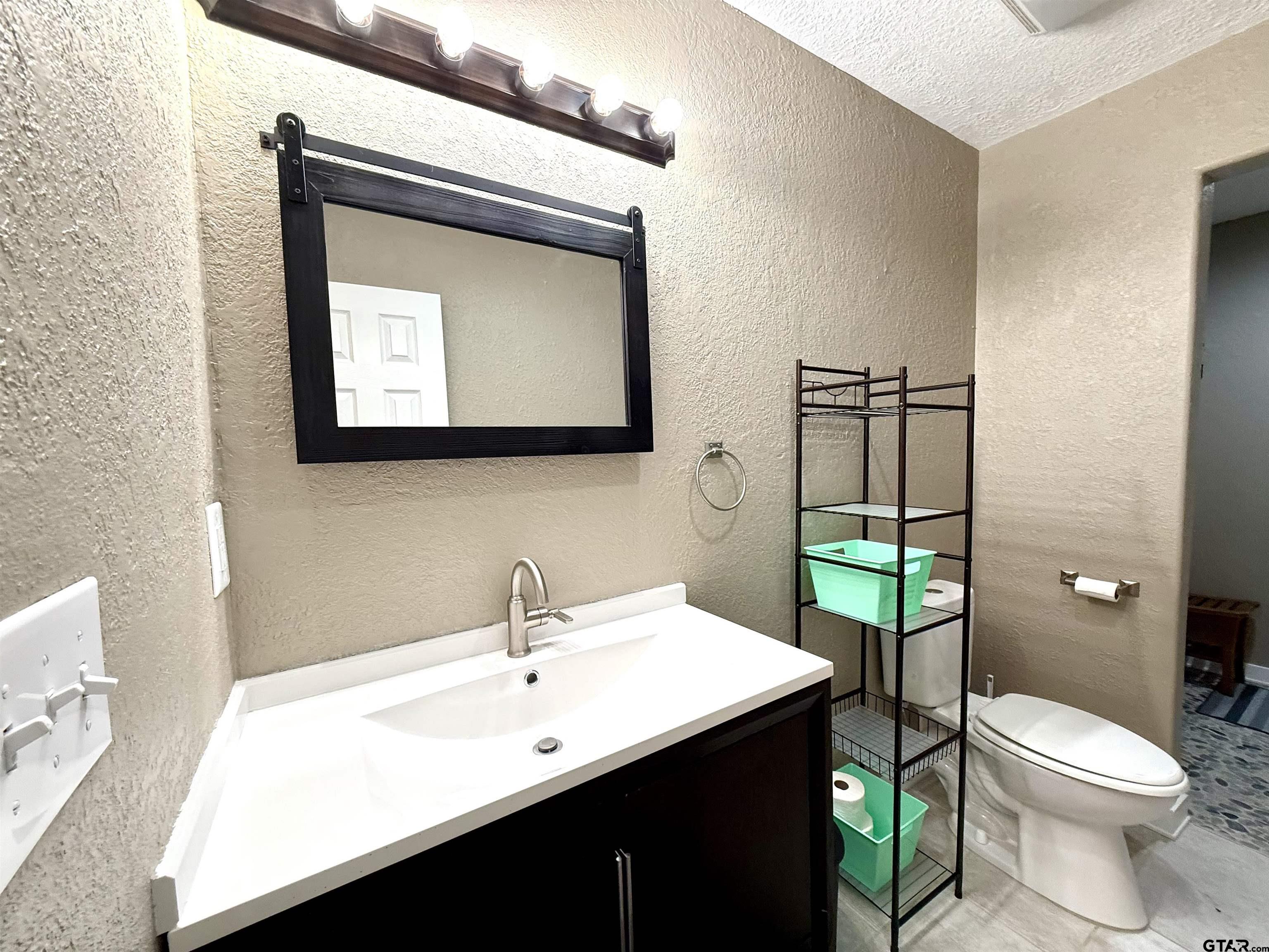 449 Rs Private Road Emory, TX 75440 - Photo 10 of 20 a bathroom with a toilet sink and mirror