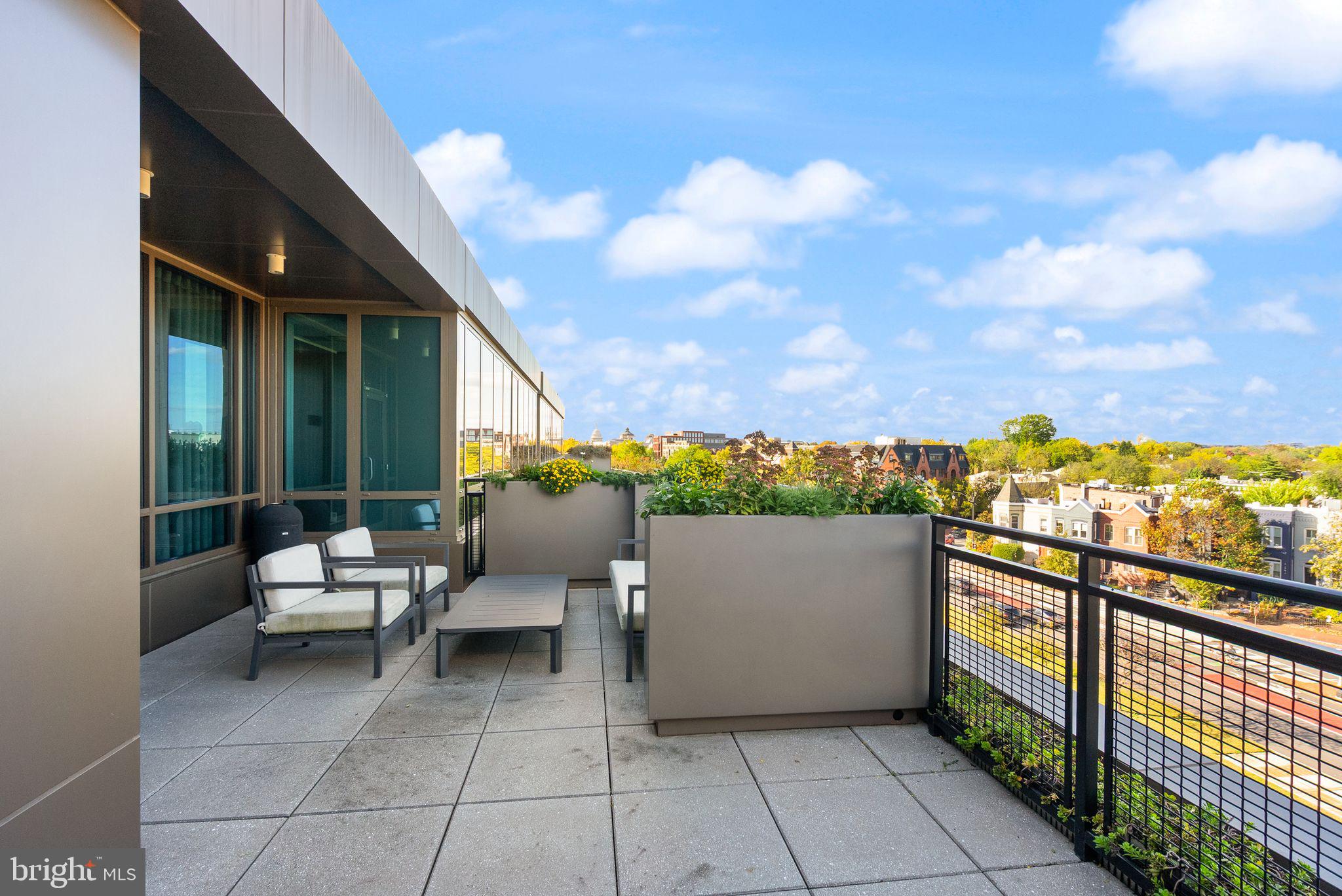 1111 Pennsylvania Ave. Southeast, Unit 304 Washington, DC 20003 - Photo 32 of 42 a view of a terrace with couches and sky view