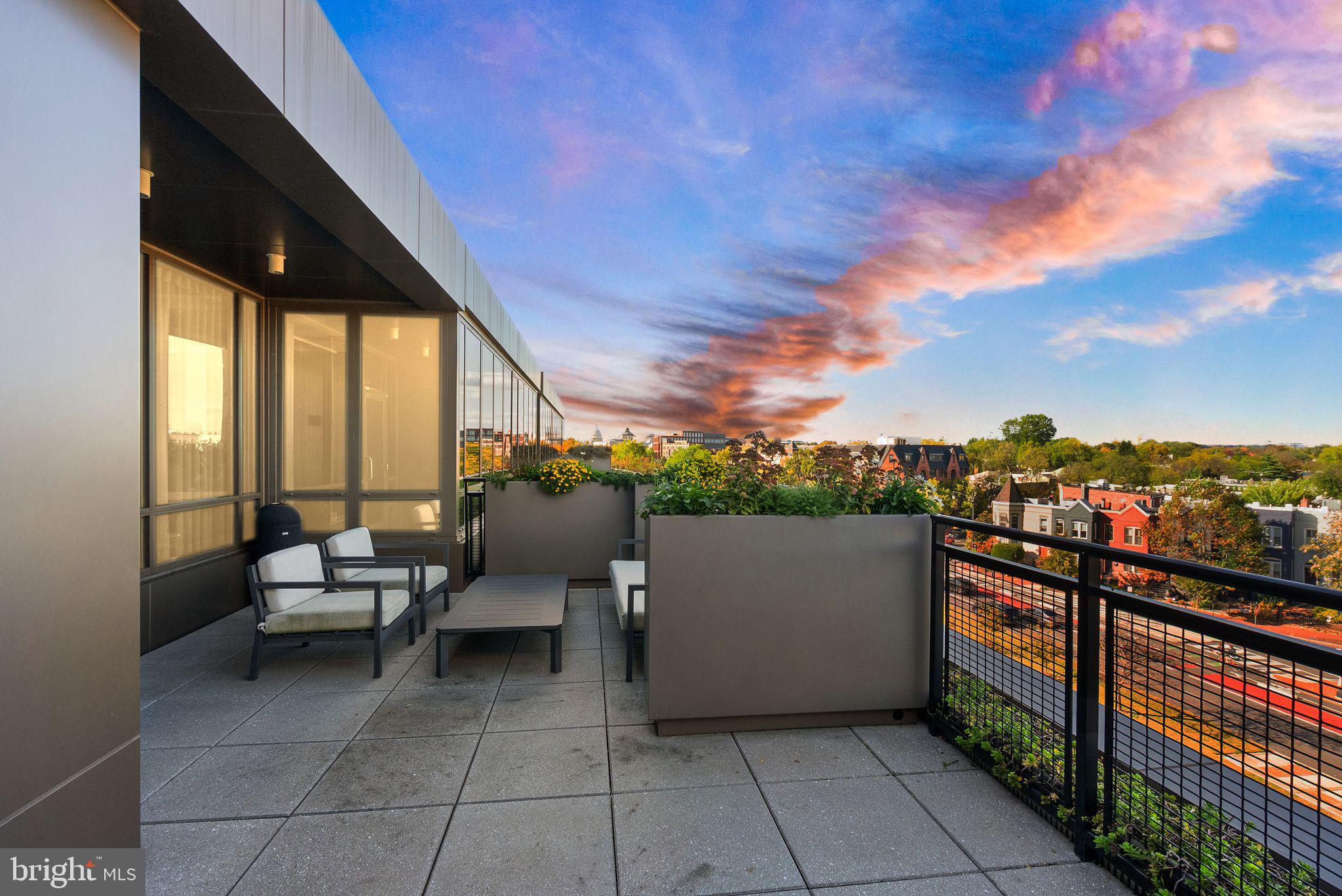 1111 Pennsylvania Ave. Southeast, Unit 304 Washington, DC 20003 - Photo 38 of 42 a view of balcony with couch and chairs