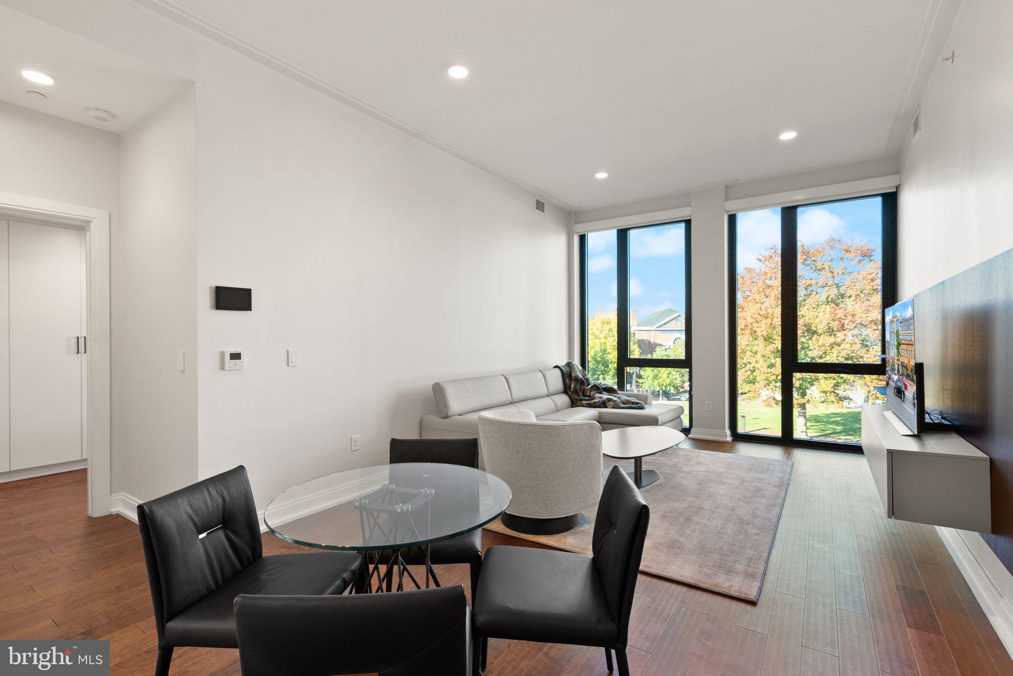 1111 Pennsylvania Ave. Southeast, Unit 304 Washington, DC 20003 - Photo 9 of 42 a view of a livingroom with furniture window and outside view